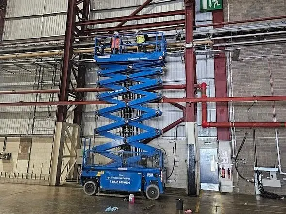 High Level Industrial Cleaning of large production studio in Edinburgh using a boom lift